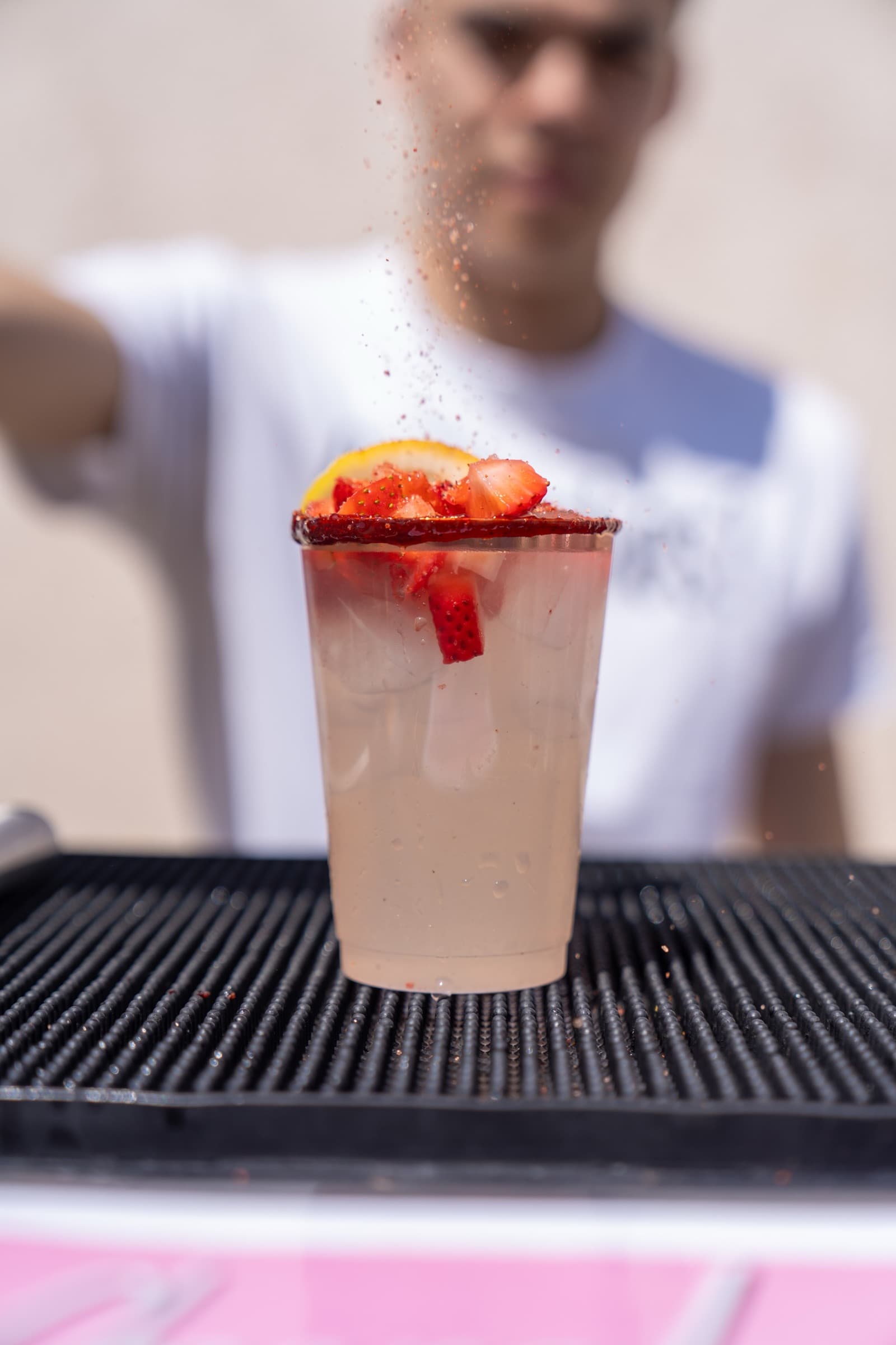 Tajín-rimmed strawberry michelada with a sparkling pour